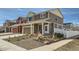 Charming two-story home featuring neutral siding, a well-manicured lawn, and a welcoming covered porch at 5541 Killarney Ct, Denver, CO 80249