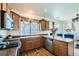 Kitchen featuring stainless steel appliances and hardwood floors with bar stool seating and lots of natural light at 5541 Killarney Ct, Denver, CO 80249