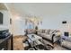 Inviting living room with cozy seating, a stylish rug, and lots of natural light at 5541 Killarney Ct, Denver, CO 80249