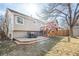 Charming backyard featuring a wooden deck, lush grass, and a tranquil ambiance at 9905 Foxhill Cir, Highlands Ranch, CO 80129