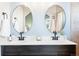 Bathroom featuring double sinks, modern fixtures, and plenty of counter space at 9905 Foxhill Cir, Highlands Ranch, CO 80129
