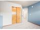 Bedroom featuring soft carpet and a closet with wood paneled sliding doors at 9905 Foxhill Cir, Highlands Ranch, CO 80129