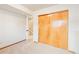 Bedroom featuring soft carpet and a closet with wood paneled sliding doors at 9905 Foxhill Cir, Highlands Ranch, CO 80129
