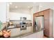 Well-equipped kitchen with stainless steel appliances, a granite countertop island, and stylish cabinets at 9905 Foxhill Cir, Highlands Ranch, CO 80129