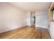 Bedroom features hardwood floors and a closet with white doors at 32171 Lodgepole Dr, Evergreen, CO 80439