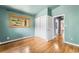Bedroom featuring wood floors, closet and a double hung window with a wood trim at 32171 Lodgepole Dr, Evergreen, CO 80439