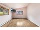 Bright bedroom featuring hardwood floors and large windows providing plenty of natural light at 32171 Lodgepole Dr, Evergreen, CO 80439