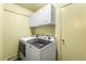 Laundry room with large washing machine and dryer at 32171 Lodgepole Dr, Evergreen, CO 80439
