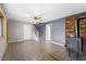 Spacious living room featuring a wood burning stove, tile floors, and neutral paint colors at 32171 Lodgepole Dr, Evergreen, CO 80439