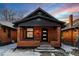 Charming brick home with a front porch and black accents, showcasing curb appeal and unique architectural details at 1439 S Sherman St, Denver, CO 80210