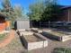 Spacious backyard featuring several raised garden beds perfect for growing your own produce at 6176 S Adams Dr, Centennial, CO 80121