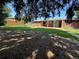 Home with backyard featuring green grass, mature trees, and fence at 6176 S Adams Dr, Centennial, CO 80121
