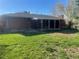 Brick home with covered patio and spacious grass yard at 6176 S Adams Dr, Centennial, CO 80121