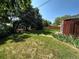 Spacious backyard with lush green lawn and large shade trees at 6176 S Adams Dr, Centennial, CO 80121