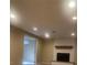 Basement area featuring fireplace, recessed lights, and doorway at 6176 S Adams Dr, Centennial, CO 80121