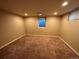 Large finished basement has carpet floors and a window allowing for natural light at 6176 S Adams Dr, Centennial, CO 80121