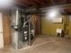 The basement has the furnace, utility sink, and some storage for this home at 6176 S Adams Dr, Centennial, CO 80121
