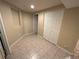 A finished basement bedroom features tile flooring and a large closet at 6176 S Adams Dr, Centennial, CO 80121