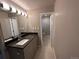 Modern bathroom with elegant vanity and tiled floors at 6176 S Adams Dr, Centennial, CO 80121