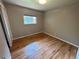 Bright bedroom with hardwood floors and natural light from a large window at 6176 S Adams Dr, Centennial, CO 80121
