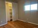 Comfortable bedroom with hardwood floors, closet, and natural light at 6176 S Adams Dr, Centennial, CO 80121