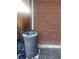 Rain barrel on the side of the brick home at 6176 S Adams Dr, Centennial, CO 80121