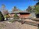 Charming single-story home with a well-maintained brick exterior and a fenced yard at 6176 S Adams Dr, Centennial, CO 80121