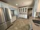Renovated kitchen with stainless steel appliances and white cabinetry at 6176 S Adams Dr, Centennial, CO 80121