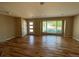 Spacious living room with hardwood floors and a large bay window for natural light at 6176 S Adams Dr, Centennial, CO 80121