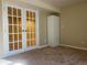 An office featuring french doors, a wardrobe and carpet at 6176 S Adams Dr, Centennial, CO 80121