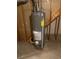 Rheem water heater with energy guide in unfinished room at 6176 S Adams Dr, Centennial, CO 80121
