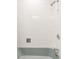 Classic bathroom features a tiled shower with chrome fixtures and a practical, clean design at 6842 W Eldorado Pl, Lakewood, CO 80227