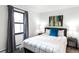 Comfortable bedroom features a stylish decor, a window and cozy carpet at 6842 W Eldorado Pl, Lakewood, CO 80227