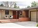 Inviting front porch with cozy seating area, charming details, and convenient garage access at 6842 W Eldorado Pl, Lakewood, CO 80227