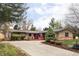 Charming ranch-style home with a well-maintained front yard and ample parking space at 6842 W Eldorado Pl, Lakewood, CO 80227
