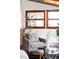 Cozy sunroom with terracotta tile floors, comfortable seating, natural light, and views of the outdoors at 6842 W Eldorado Pl, Lakewood, CO 80227