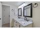 Double vanity in updated bathroom with sink and mirror at 942 S Walden St # 206, Aurora, CO 80017