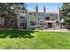 Exterior of multi-unit home with green grass and landscaping at 942 S Walden St # 206, Aurora, CO 80017