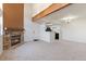 Open living room features a stone fireplace and a view into the adjacent kitchen at 942 S Walden St # 206, Aurora, CO 80017