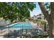 Community swimming pool with lounge chairs at 942 S Walden St # 206, Aurora, CO 80017