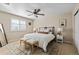 Comfortable bedroom featuring neutral tones, plush furnishings and natural light at 7887 S Kittredge Cir, Englewood, CO 80112