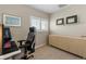 Home office area features natural lighting from the window and cabinet storage at 7887 S Kittredge Cir, Englewood, CO 80112