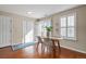 Cozy dining area with natural light, neutral paint and modern decor at 7887 S Kittredge Cir, Englewood, CO 80112