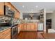 Well-equipped kitchen with granite countertops, stainless appliances and wood cabinets at 7887 S Kittredge Cir, Englewood, CO 80112