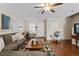 Cozy living room with hardwood floors, comfortable seating, and ample natural light at 7887 S Kittredge Cir, Englewood, CO 80112