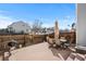 Private patio space with table and chairs with charcoal grill and privacy fence at 7887 S Kittredge Cir, Englewood, CO 80112