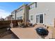 Patio with table and chairs, outdoor heater, with charcoal grill and slider door access at 7887 S Kittredge Cir, Englewood, CO 80112