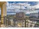 This balcony provides scenic city views, complete with iron railings and a glimpse of urban activity at 925 N Lincoln St # 8E-S, Denver, CO 80203
