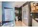 Modern bathroom design with a towel rack and view into the hallway at 925 N Lincoln St # 8E-S, Denver, CO 80203