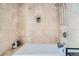 Spa-like bathroom featuring a jacuzzi tub with beautiful tile surround and modern fixtures at 925 N Lincoln St # 8E-S, Denver, CO 80203
